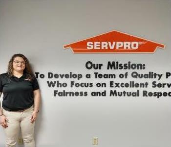 Head shot of female SERVPRO of Greensboro North employee with brown hair wearing a black ServPro logo polo.