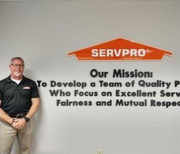 Head shot of male SERVPRO Greensboro North employee wearing glasses and company polo.