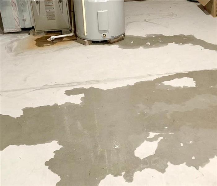 Water leak from water heater on basement floor